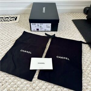 Chanel empty shoe box, two Chanel dust bags, Chanel care instructions, tissue pp